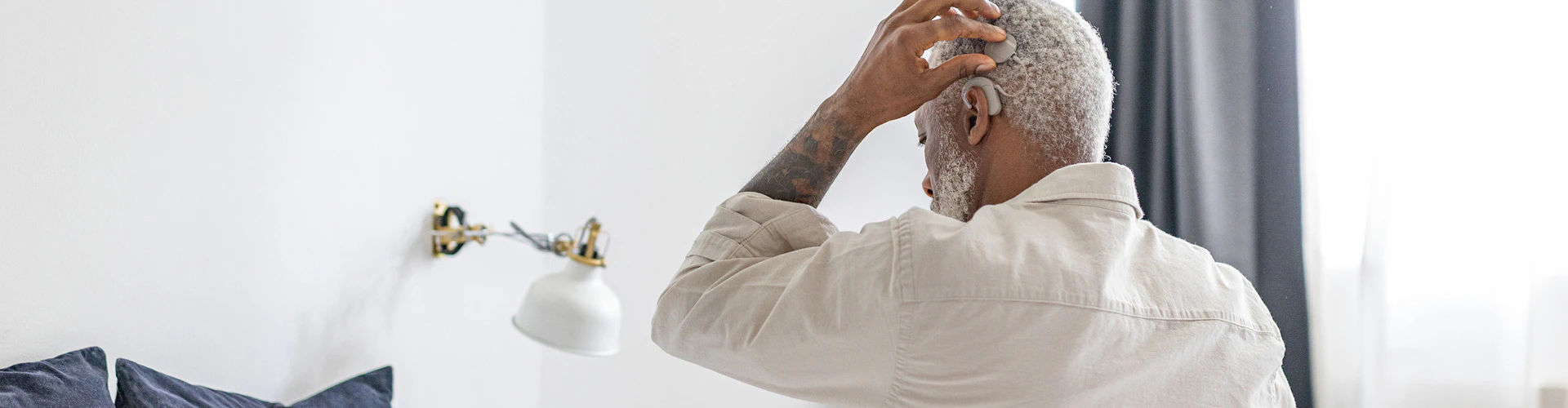 An older SONNET 3 user prepares for a day of closest to natural hearing.