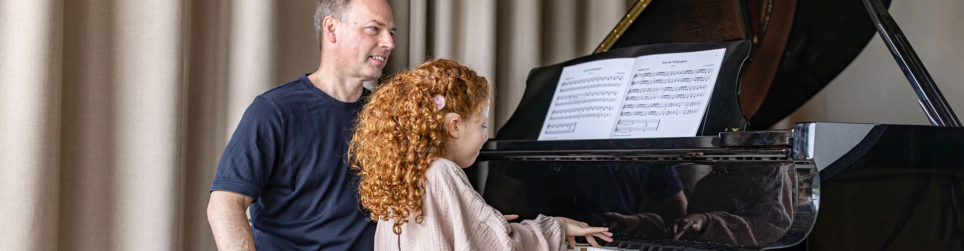 A young SONNET 3 user enjoys her piano lesson.