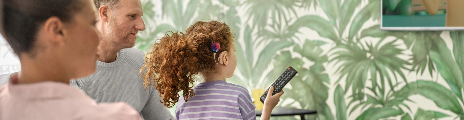 A young SONNET 3 user streams cartoons directly to her audio processors.